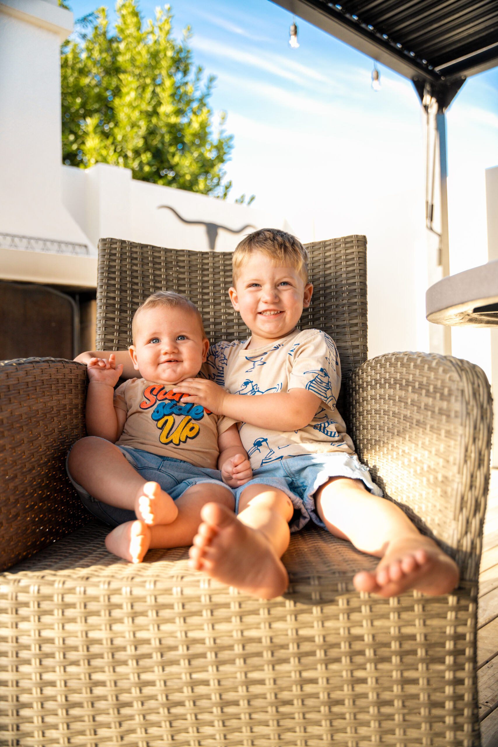 Two Kids Sitting on Chair Photography Example